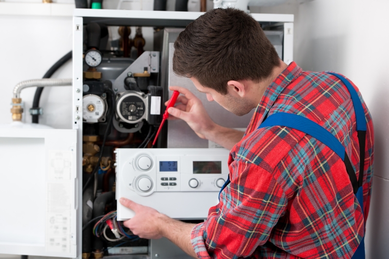 Gas Safe engineer working on a boiler in Paddington